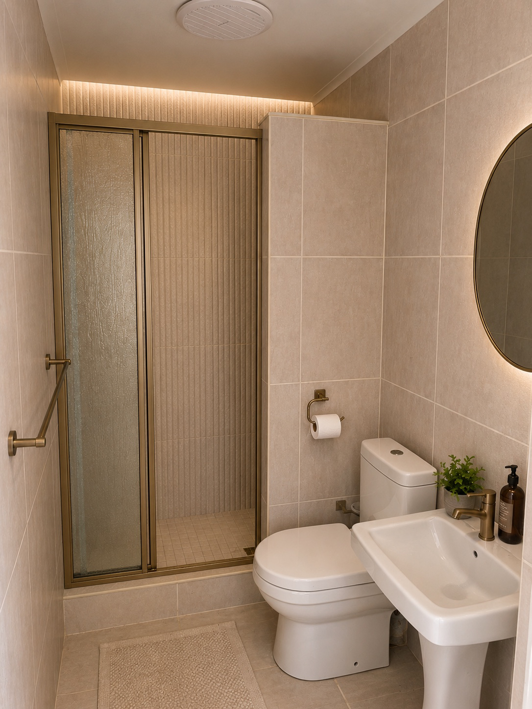 Warm guest bathroom with a brass-trimmed shower